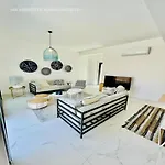 By The 7 *